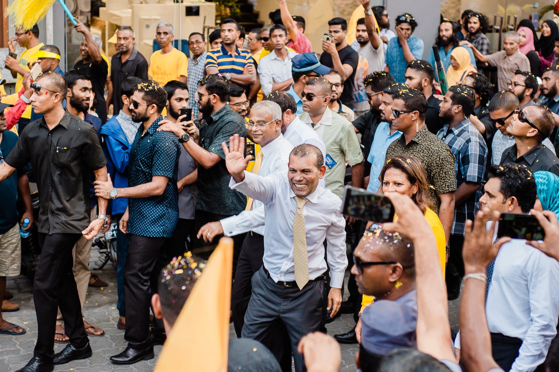 man waving to the people